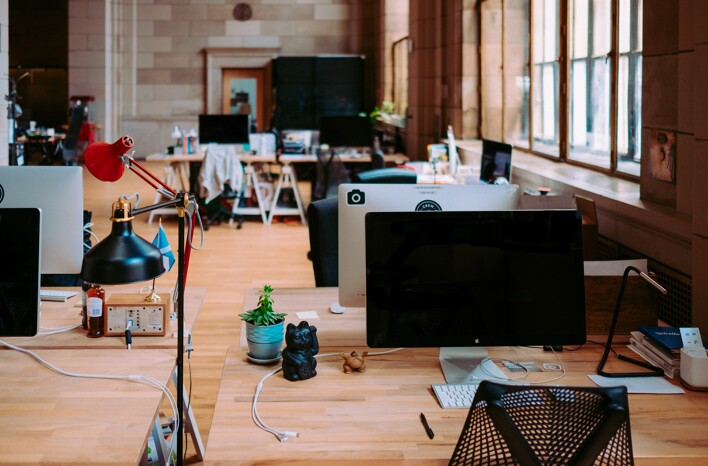 messy office open space with computers