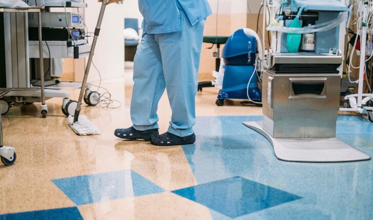 Woman mopping hospital floor