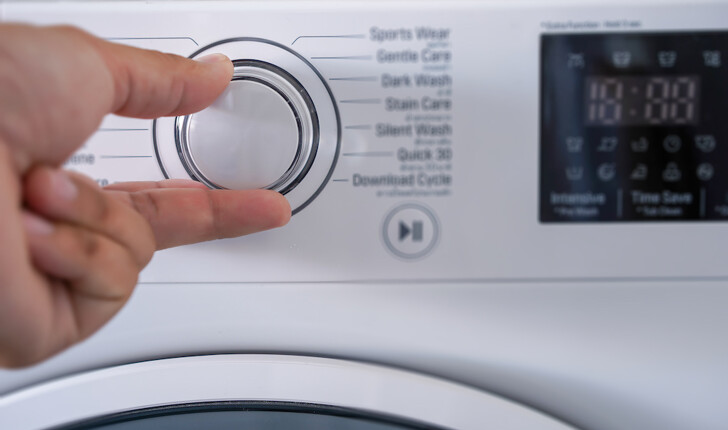 washing machine temperature being adjusted
