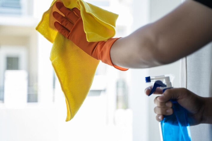 cleaning window with microfibre cloth and cleaning solution