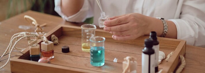 Woman creating DIY essential oil blends