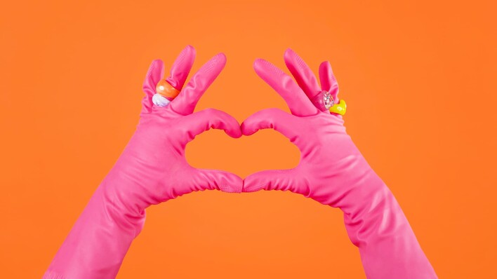 pink gloves making a heart 