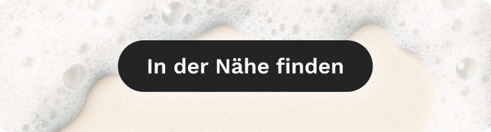 Reinigungsschaum im Hintergrund mit CTA ‚Pro in der Nähe finden‘