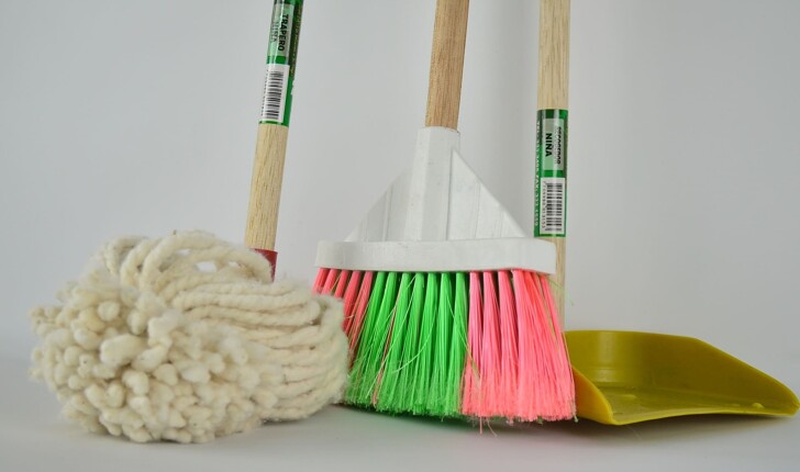 A mop, a dust pan and brush for cleaning services