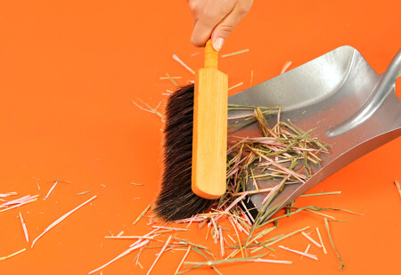 A housekeeper is sweeping the floor